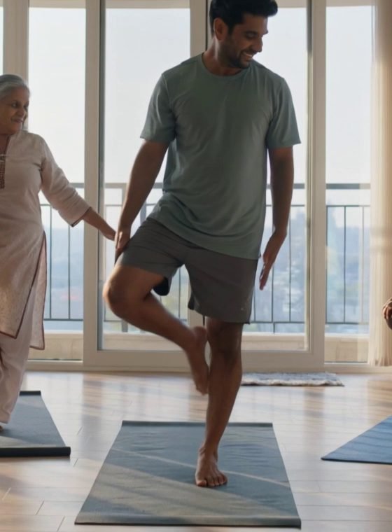 Man balancing in tree pose